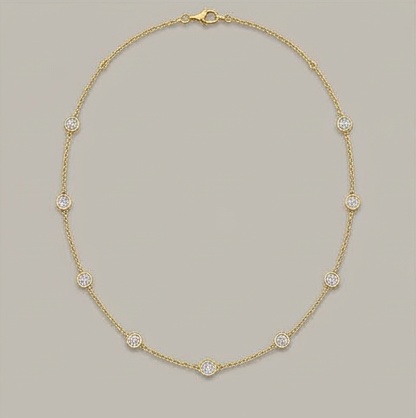 Bezel-set diamonds spaced along a delicate gold chain